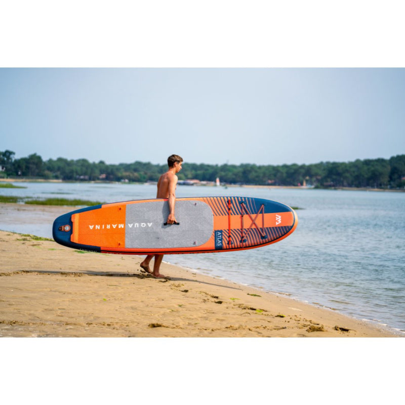 Man Carrying Aqua Marina Atlas iSUP to the Water