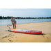 Man Using Air Pump to Inflate Aqua Marina Atlas SUP on Beach