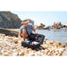 Man Opening Box with Aqua Marina BlueDrive K Kayak Motor on Beach