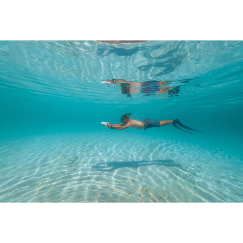 Man using Aqua Marina BlueDrive X Pro Electric Underwater Jet while swimming in ocean 