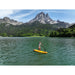 Man Paddling Aqua Marina Fusion Inflatable SUP on Lake Surrounded by Mountains