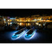 2 Aqua Marina Glow Inflatable SUPs Lit Up in White at Night on the Dock