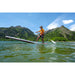 Man Paddling Aqua Marina Hyper Inflatable SUP with Front End Up Above the Water