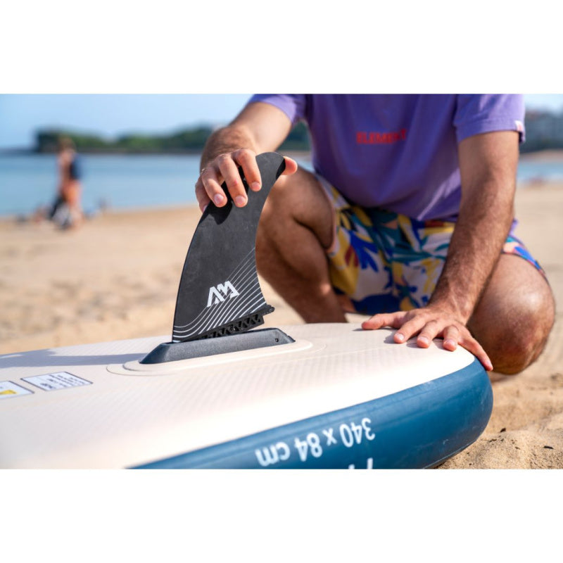 Person Attaching Swift Attach Center Fin on Aqua Marina Magma Inflatable SUP