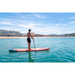 Man Paddling Aqua Marina Monster Inflatable SUP in Ocean Along Coastline