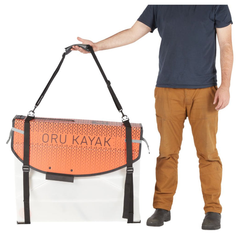 Man Holding Strap of Oru Kayak Coast XT Carrying Bag