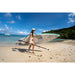 Woman Using Shoulder Strap to Carrying Sipaboards Drive Tourer Electric SUP onto Beach while Holding the Paddle 