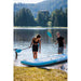 Man and Woman Standing on Shore with Spinera Adriatic 40 Inflatable Kayak in Water