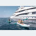 Woman and Child Paddling Spinera Adriatic 140 Inflatable Kayak in Front of Superyacht