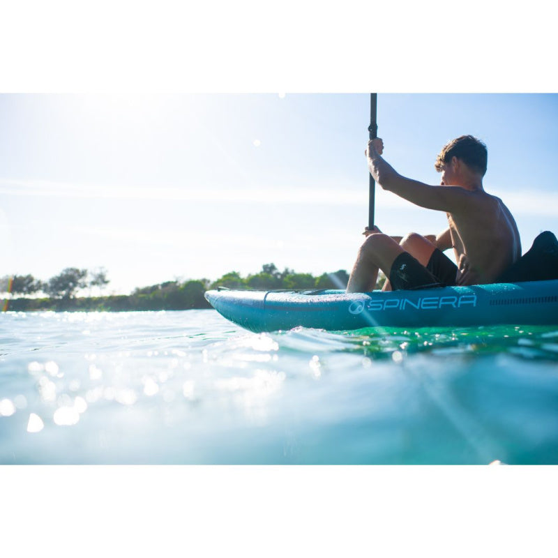 Man Paddling Spinera Hybris 320 Inflatable Kayak - View of Front and Left Side