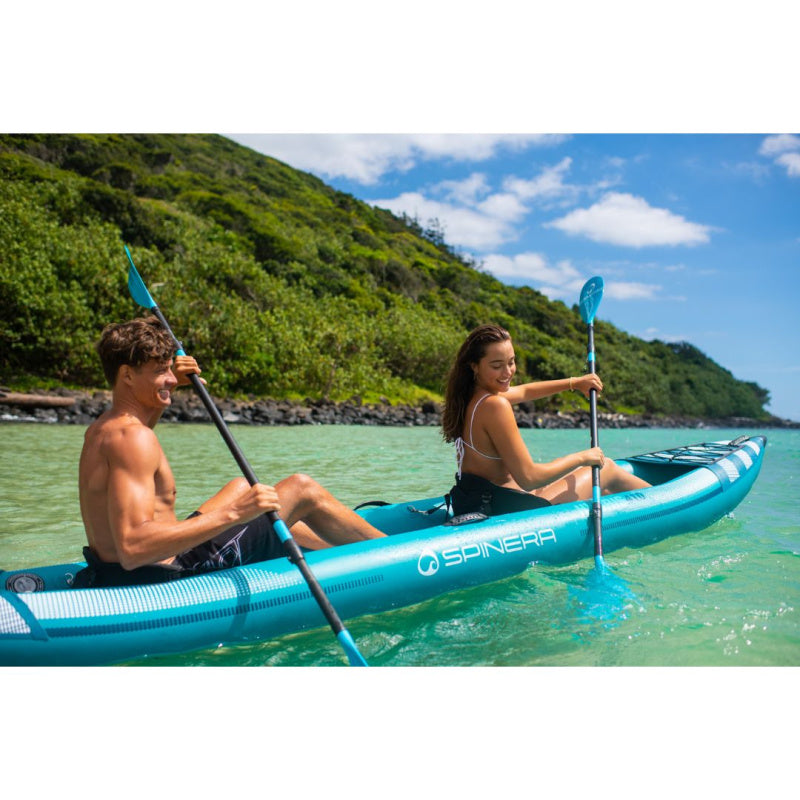 Man and Woman Paddling Spinera Hybris 410 Inflatable Kayak in Ocean Right Side View