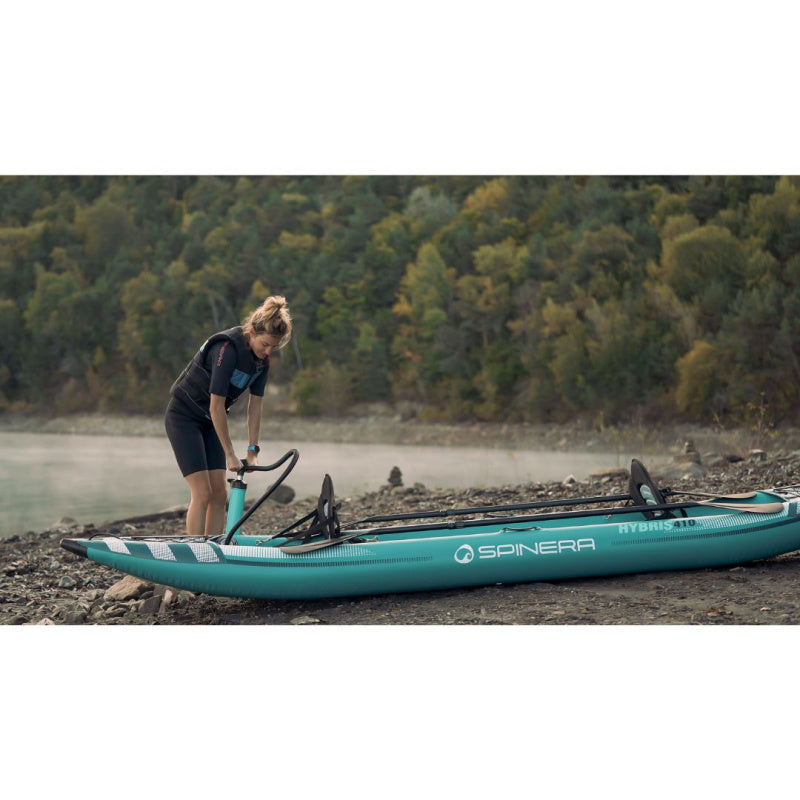 Woman Pumping Up Spinera Hybris 410 Inflatable Kayak on Beach Left Side View