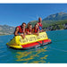 Spinera Professional Lets Go 4 Towable 4 Person Tube - 4 People Kneeling Over Back of Tube in Water