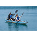 Man and Woman Paddling Spinera Tenaya 140 Inflatable Kayak in Blue Water Side View