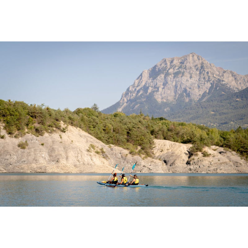 3 People Paddling Spinera Tenaya 160 Inflatable Kayak Far Left Side View with Mountains in Back