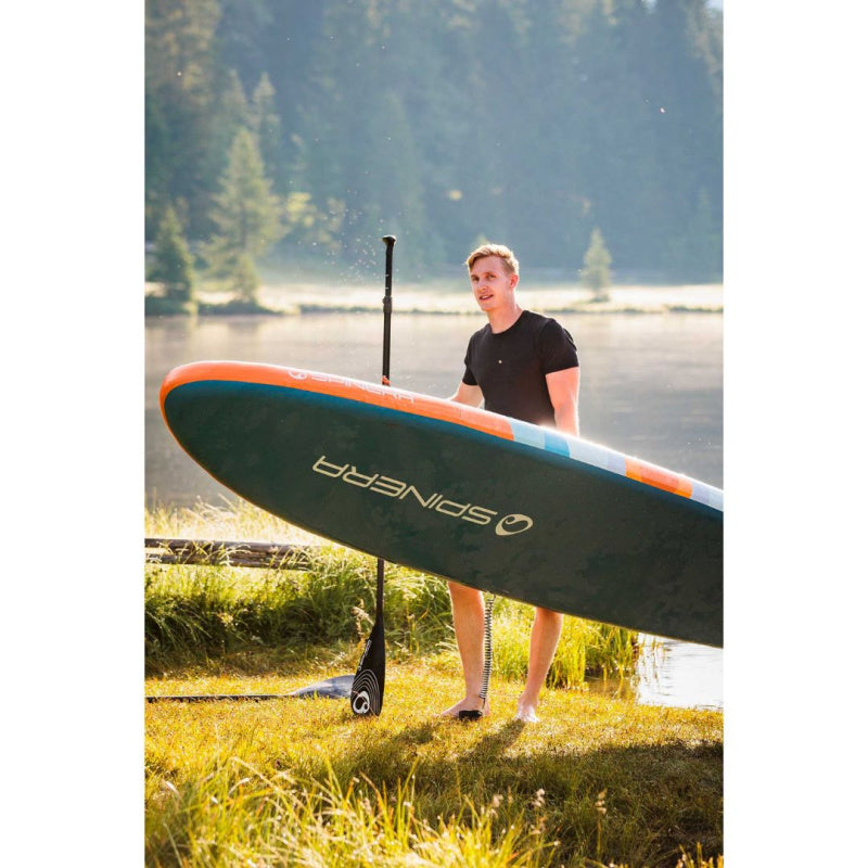 Spinera Venture Sunrise 12.0 Inflatable SUP - Man Holding Paddle & Board Showing Bottom of the Board