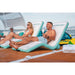 Yachtbeach Superior Sun Lounger Single - Front View of Man and Woman Laying on 2 Loungers on Floating Dock