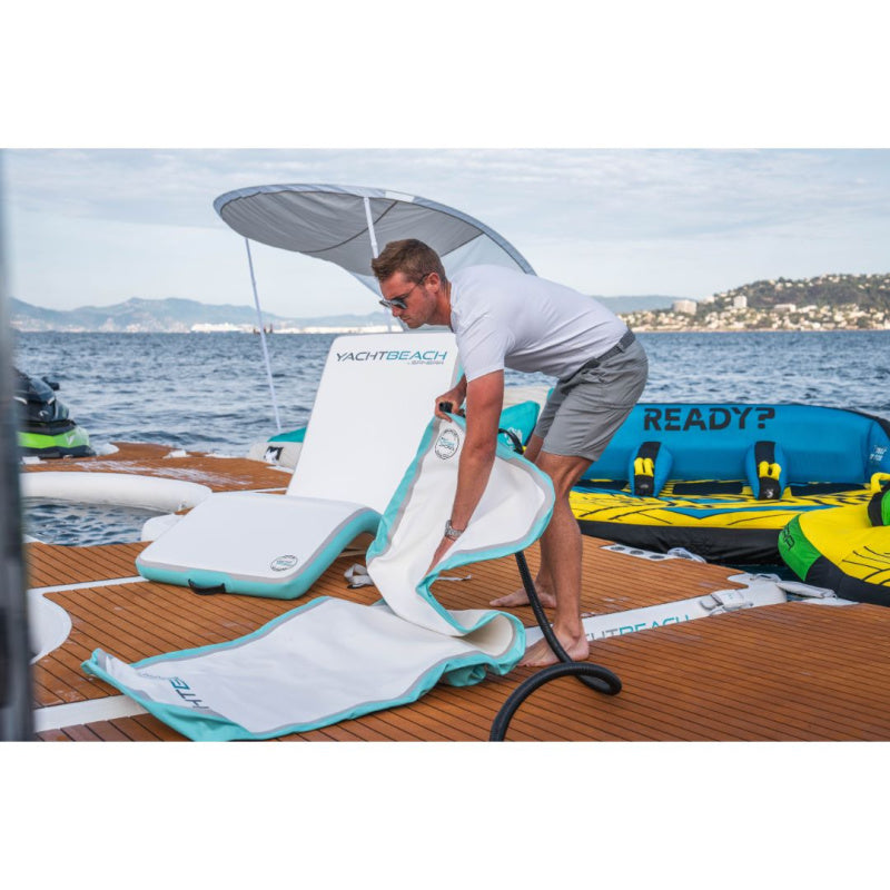 Yachtbeach Superior Sun Lounger Single - Man Unrolling Deflated Lounger with Inflated Lounger Behind